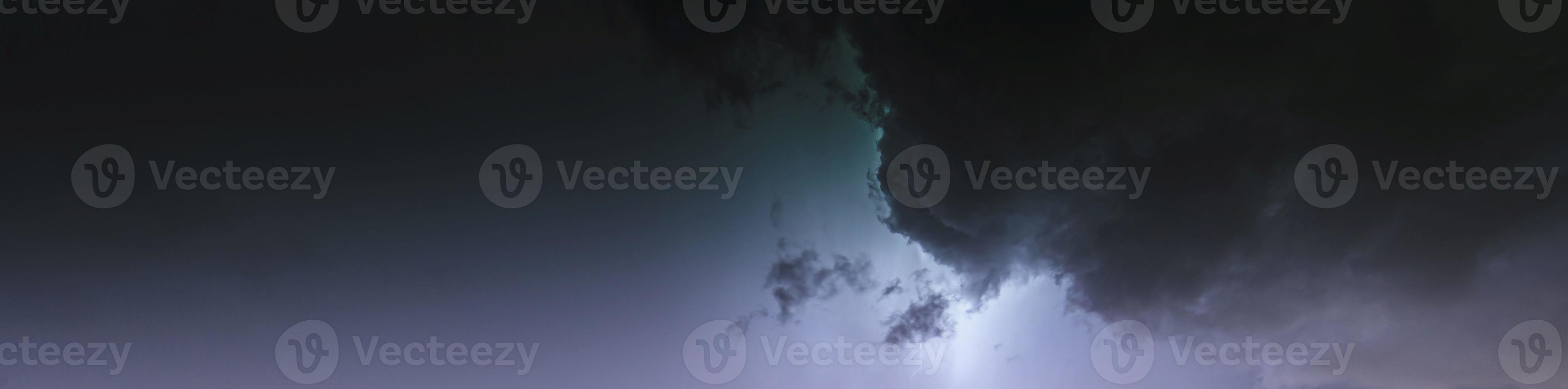 Picture of a flash in the night sky with glowing clouds photo