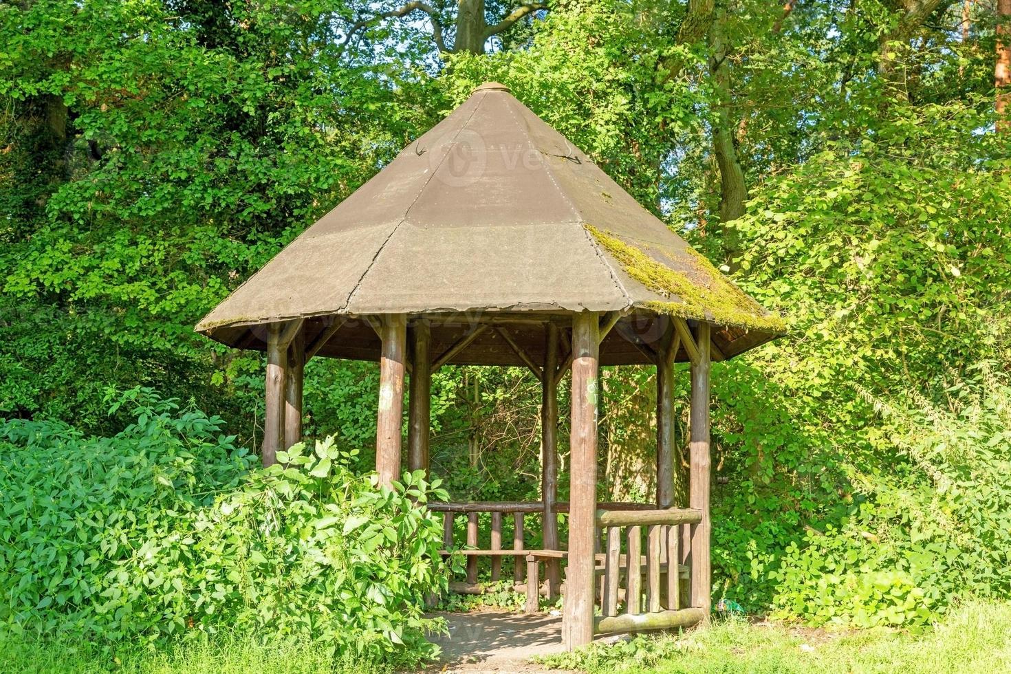 Image of a hiker's shelter in a forest path in summer photo