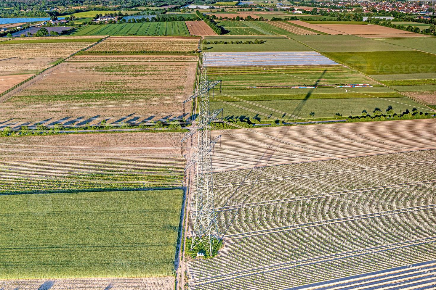 Panoramic image of high voltage road with high power poles in evening light photo