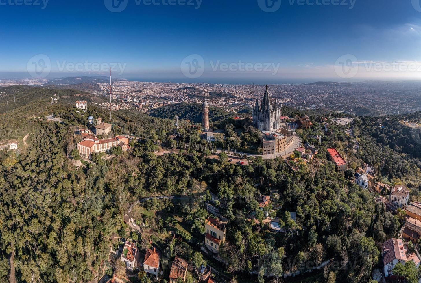 Drone panorama over Catalan metropolis Barcelona taken from Tibidabo direction during the day photo