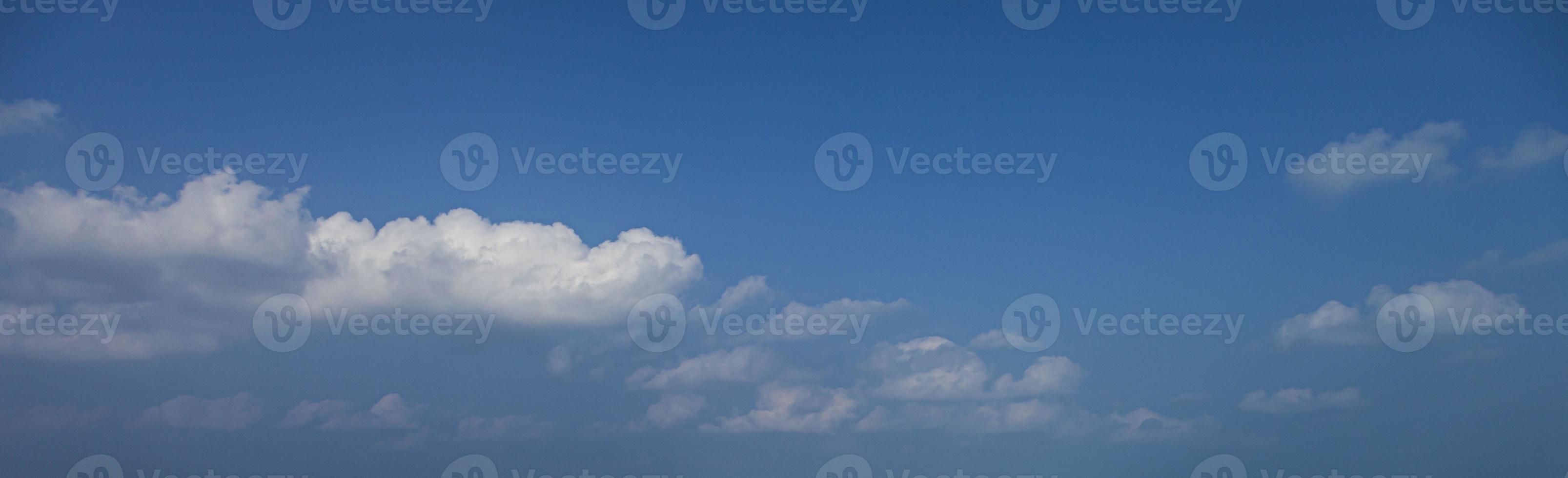 Image of a partly cloudy and partly clear sky during the day photo