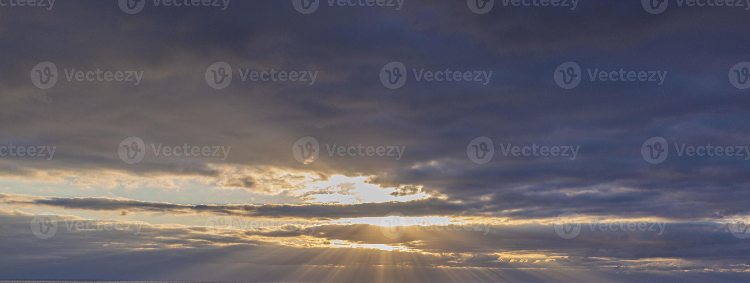 Dramatic colorful sky with afterglow and illuminated clouds photo