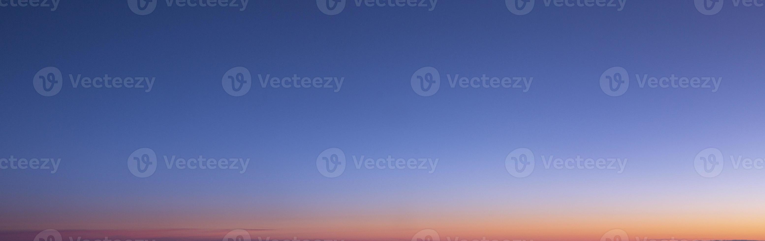 Dramatic colorful sky with afterglow and illuminated clouds photo