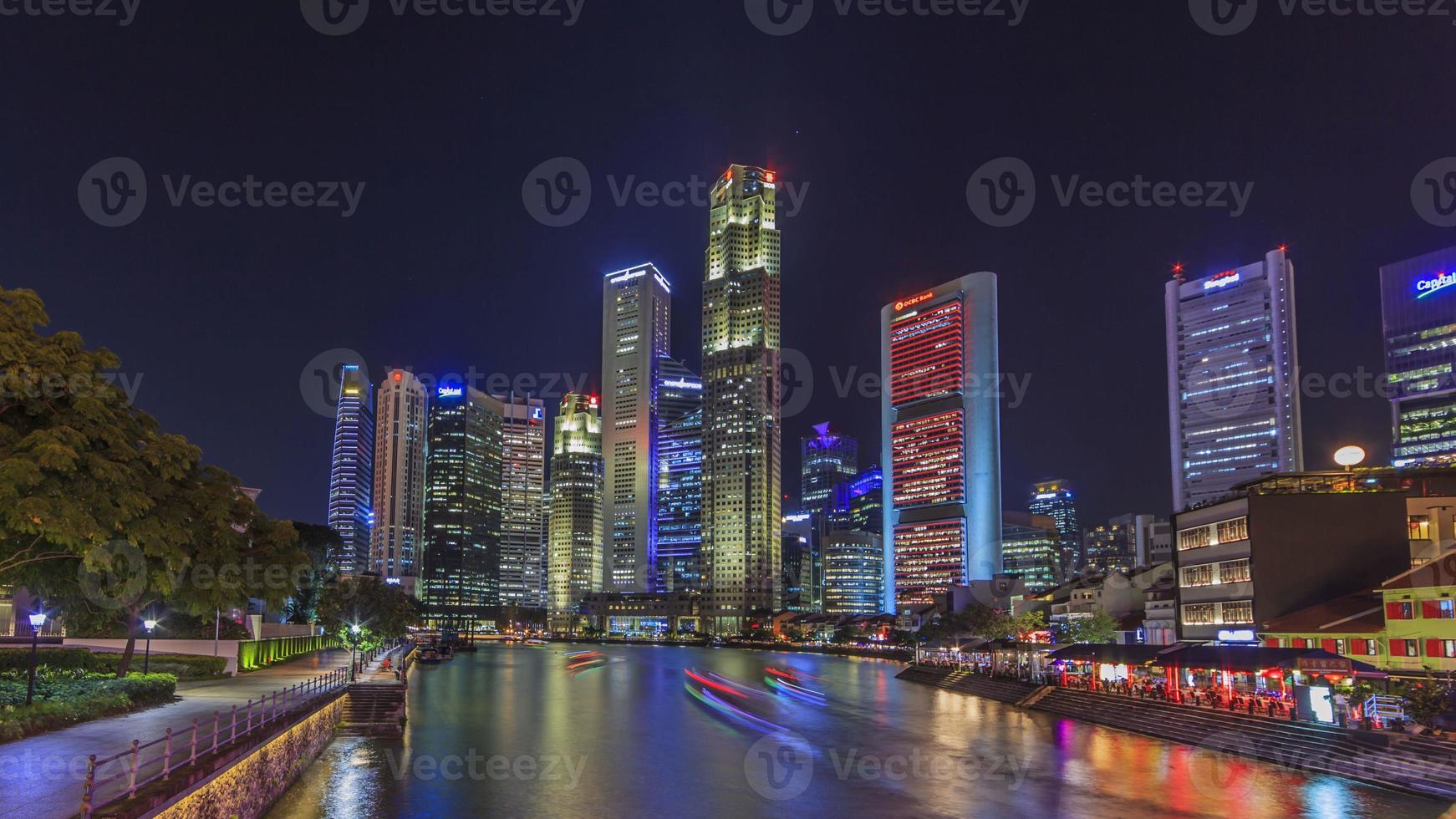 View of the Singapore River with skyline at night photo