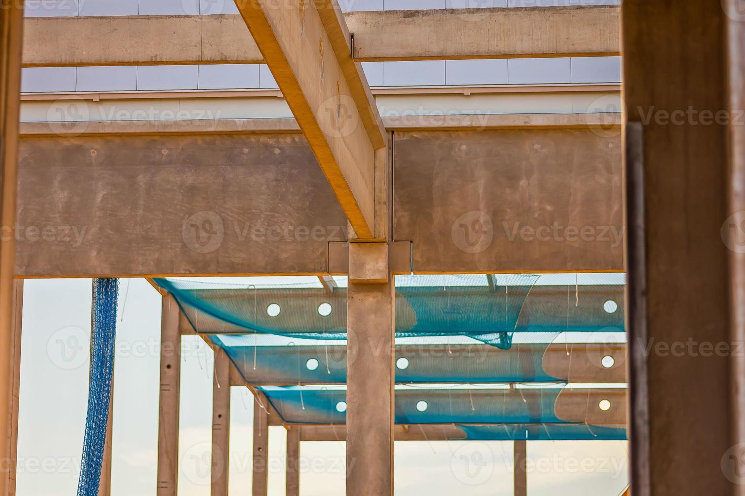 Construction site with precast concrete columns, beams and walls photo
