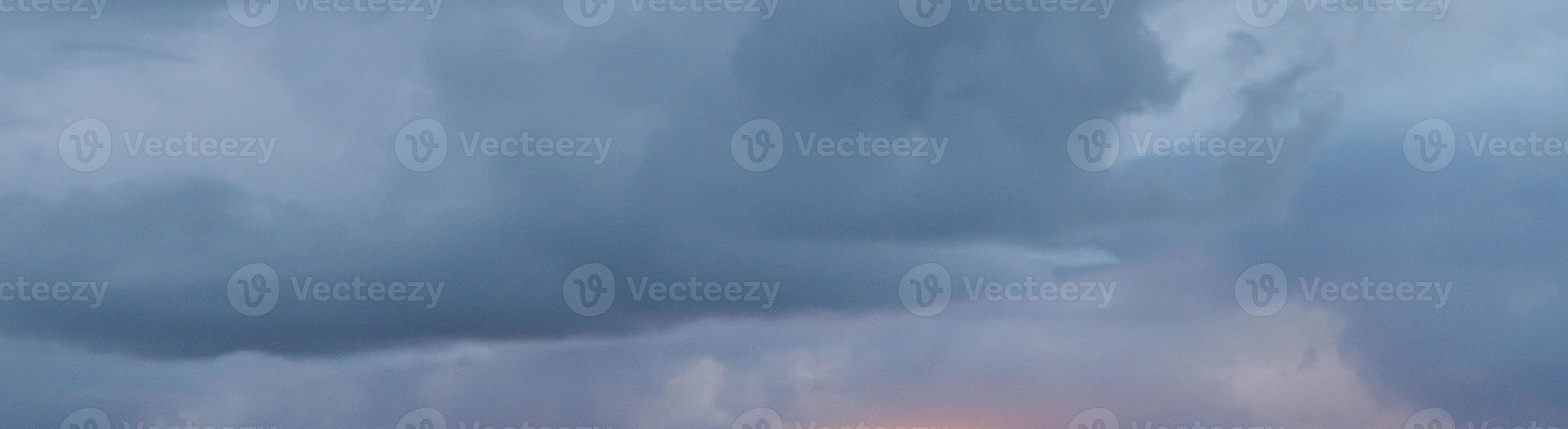 Dramatic colorful sky with afterglow and illuminated clouds photo