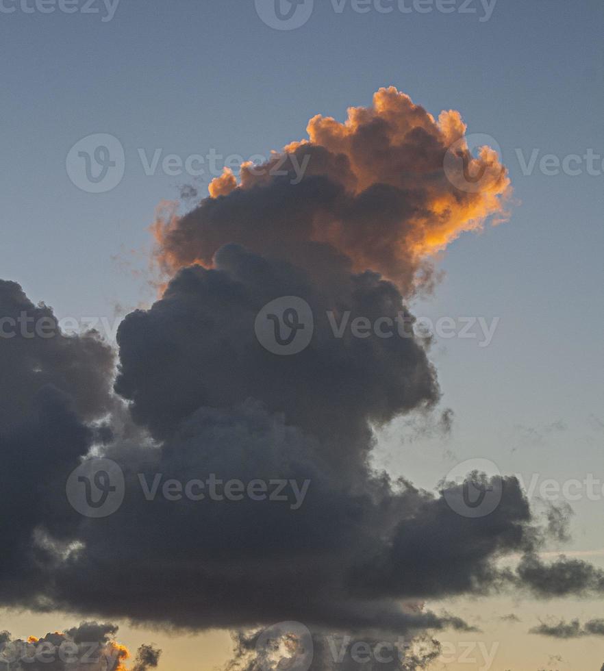 Dramatic colorful sky with afterglow and illuminated clouds photo