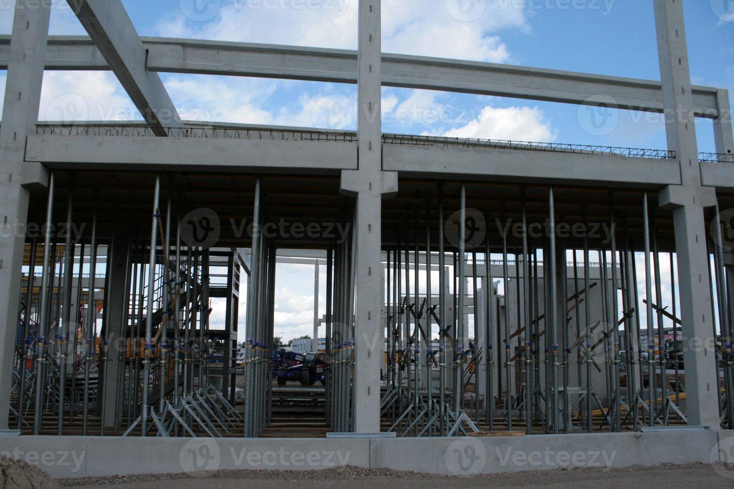 Construction site with precast concrete columns, beams and walls photo