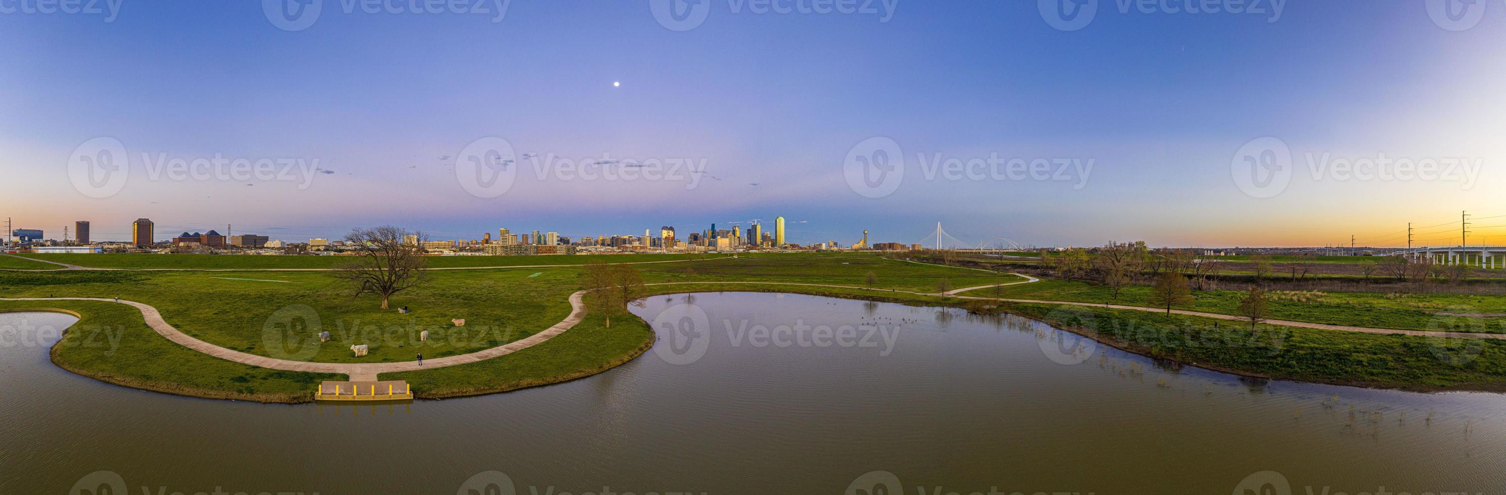 Panoramic aerial drone picture of Dallas skyline and Trammel Crow Park at sunset in winter photo