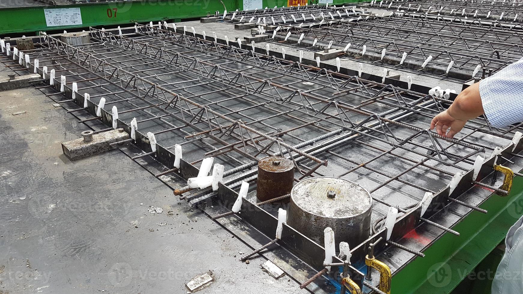 Precast concrete girder slab on a pallet with reinforcement and installation parts i ready for production photo