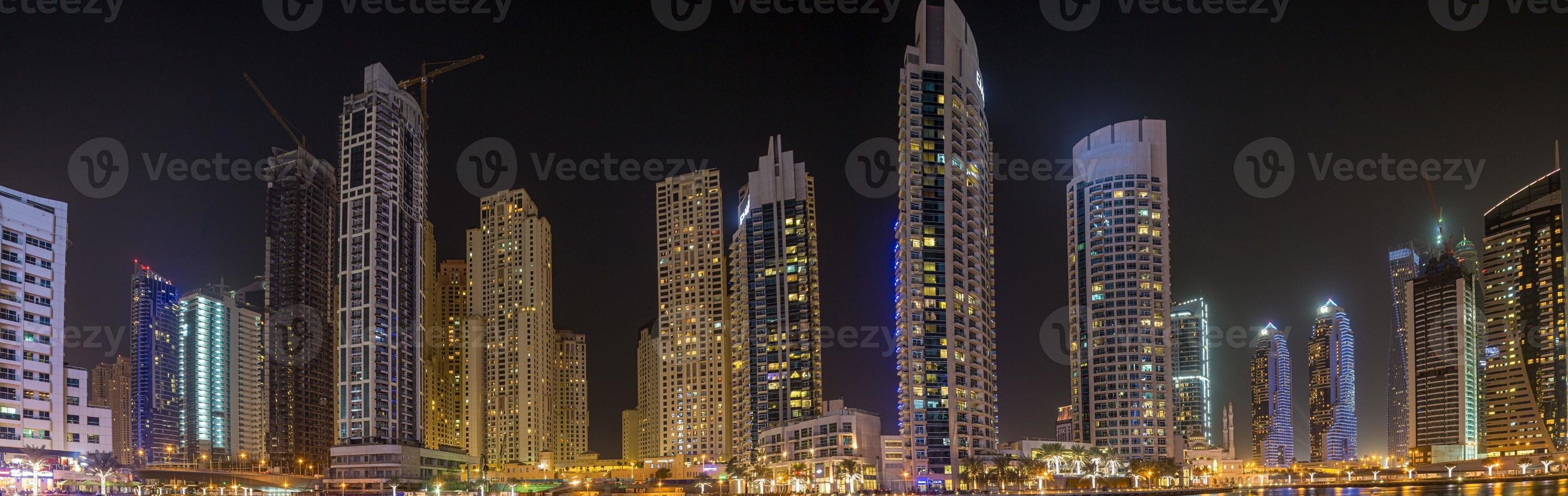 View of the skyscrapers of Dubai Marina district at night photo