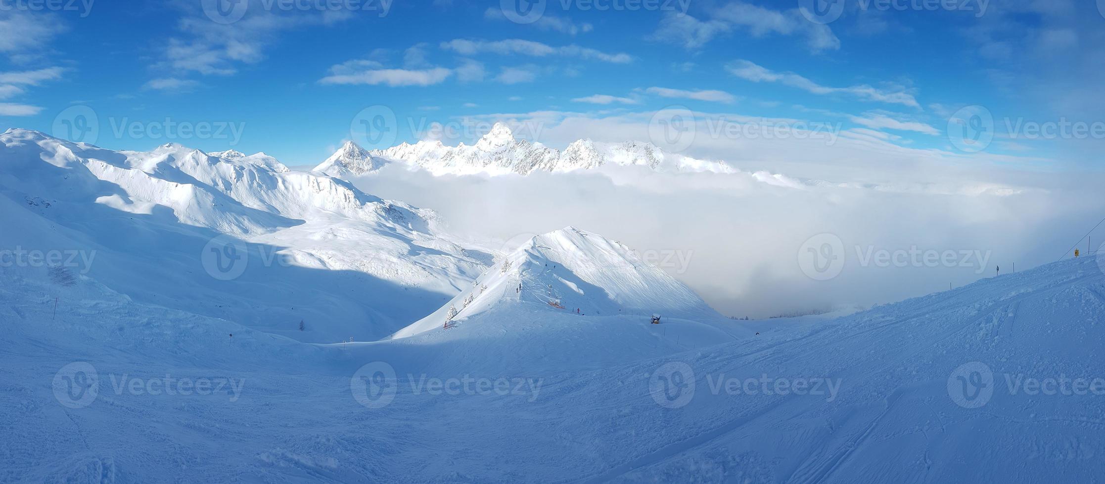 Panoramic view over snowy ski resort in Austrian Alps during daytime photo