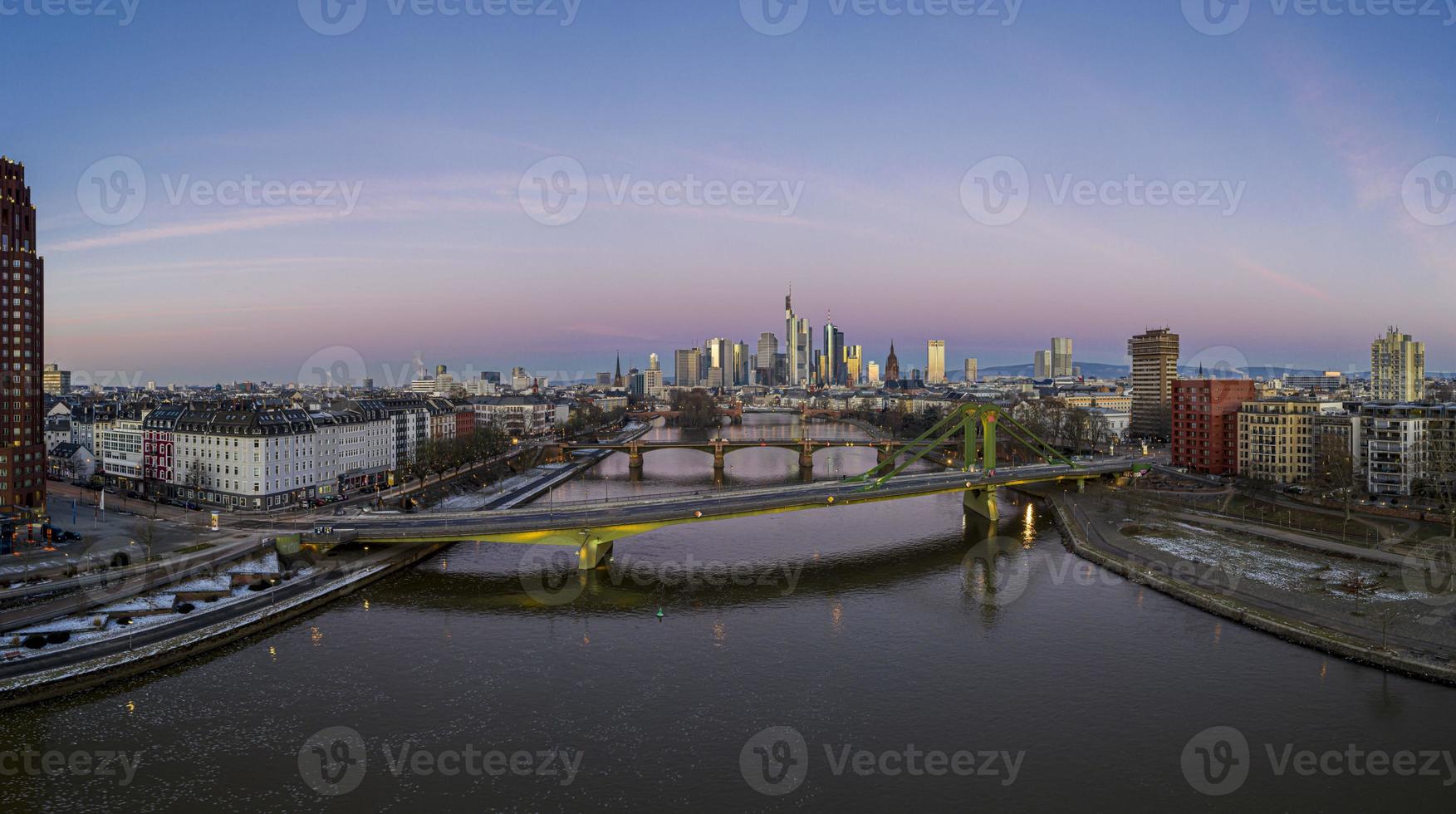 Aerial panoramic picture of Frankfurt skyline with river Main with colorful sky during sunrise photo