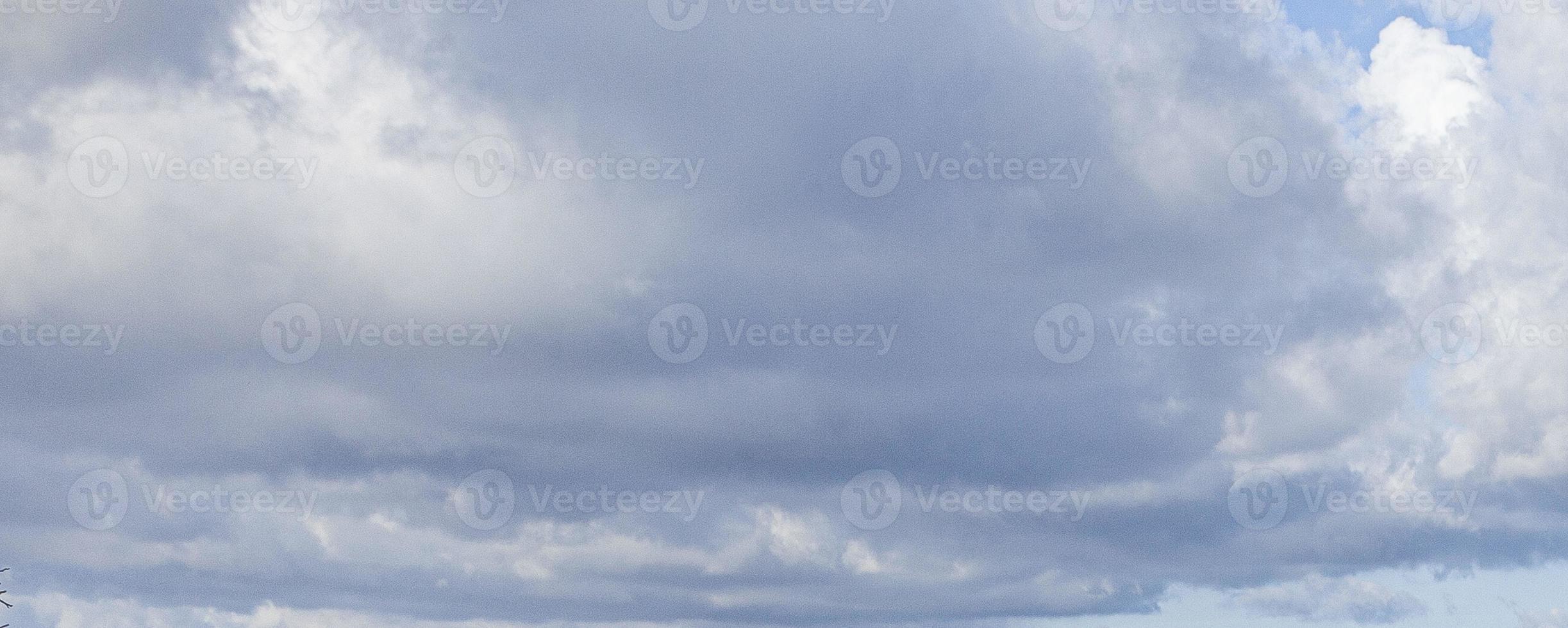 Image of a partly cloudy and partly clear sky during the day photo