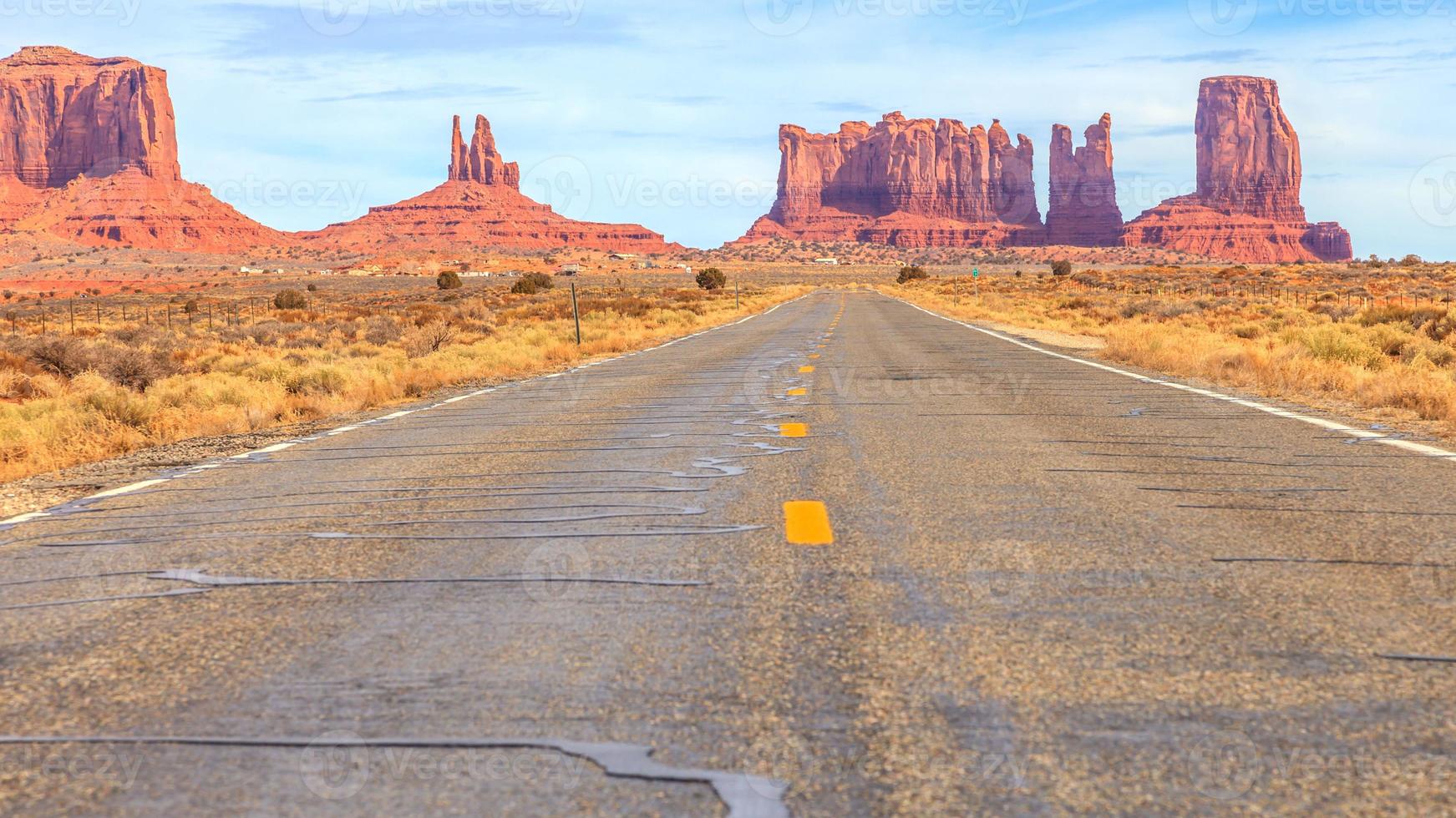 View to rocks of the Monument Valley alomg a road in the desert photo