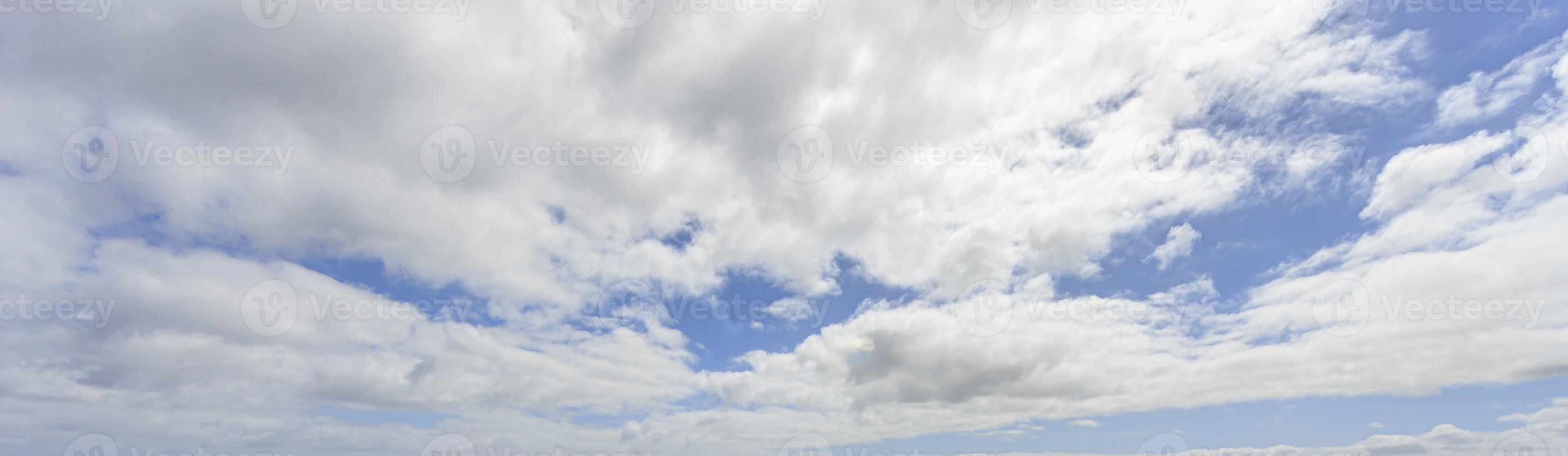 Image of a partly cloudy and partly clear sky during the day photo