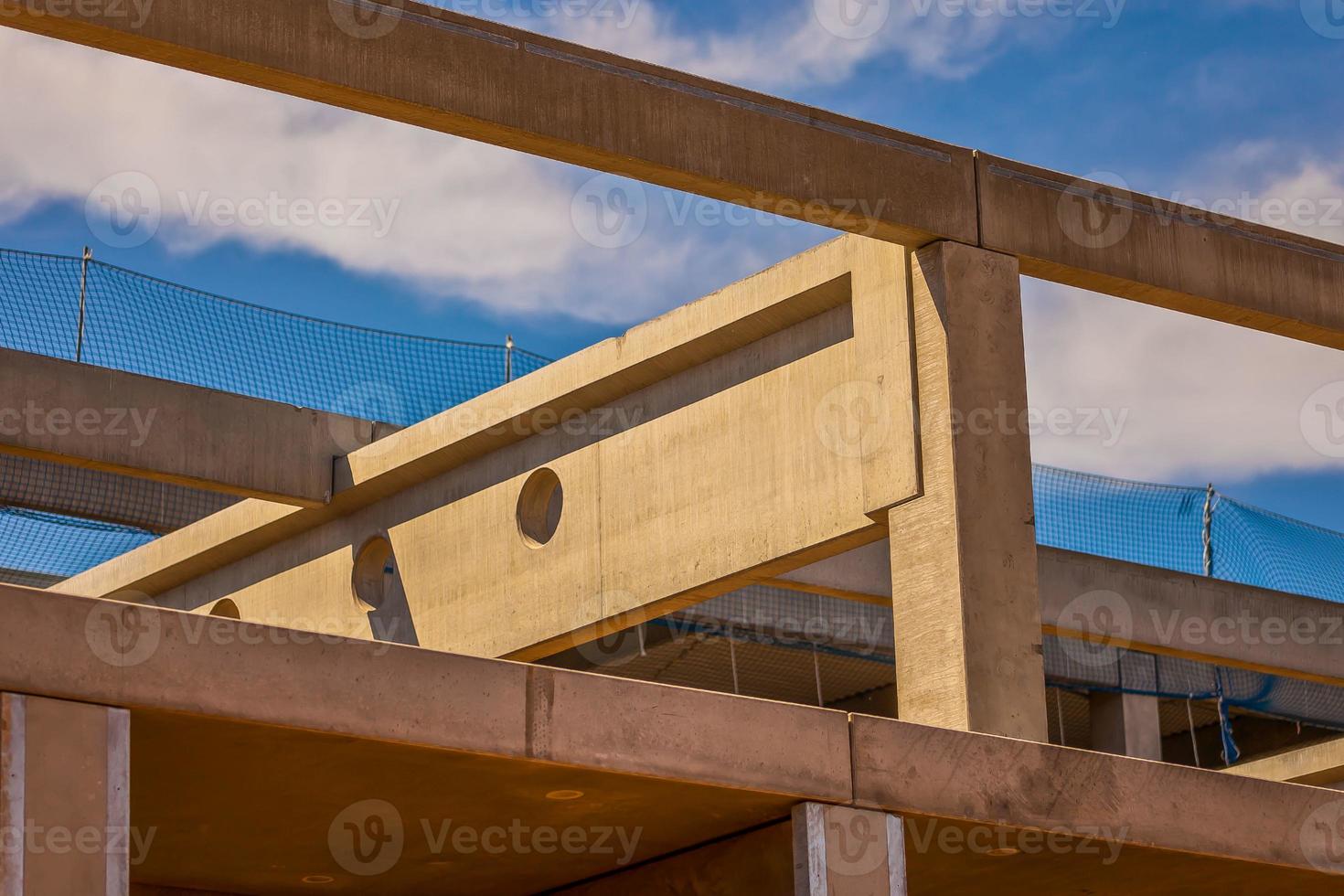 Construction site with precast concrete columns, beams and walls photo