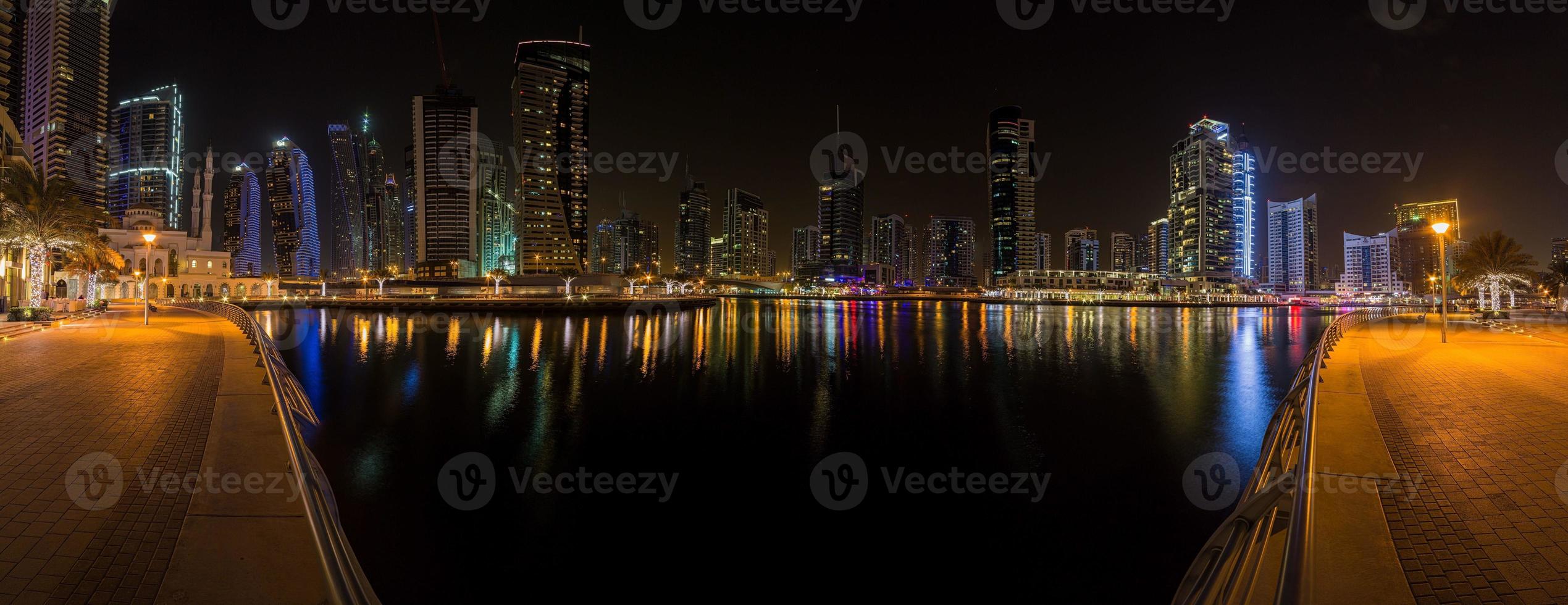 View of the skyscrapers of Dubai Marina district at night photo