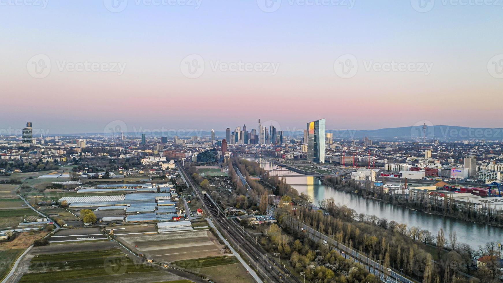 Aerial picture of Frankfurt skyline and European Central Bank building during sunrise in morning twilight photo