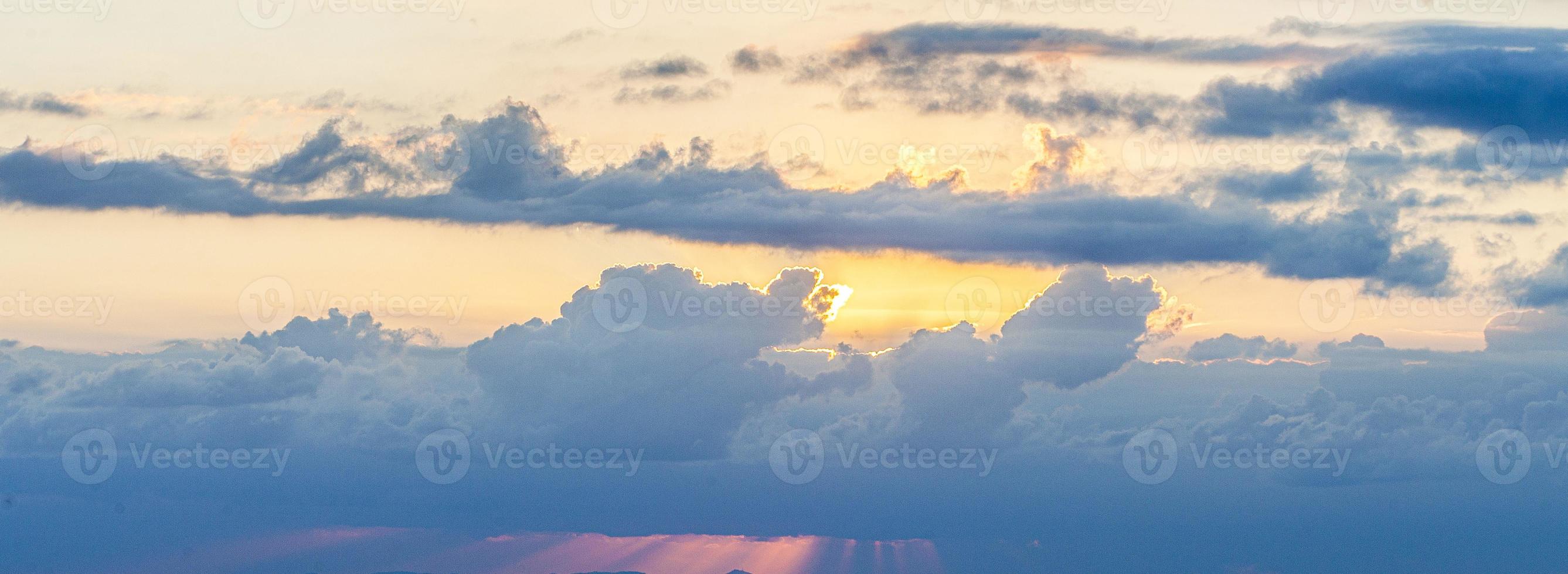 Dramatic colorful sky with afterglow and illuminated clouds photo