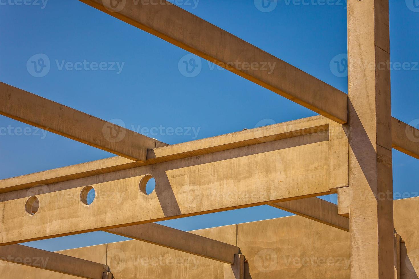 Construction site with precast concrete columns, beams and walls photo