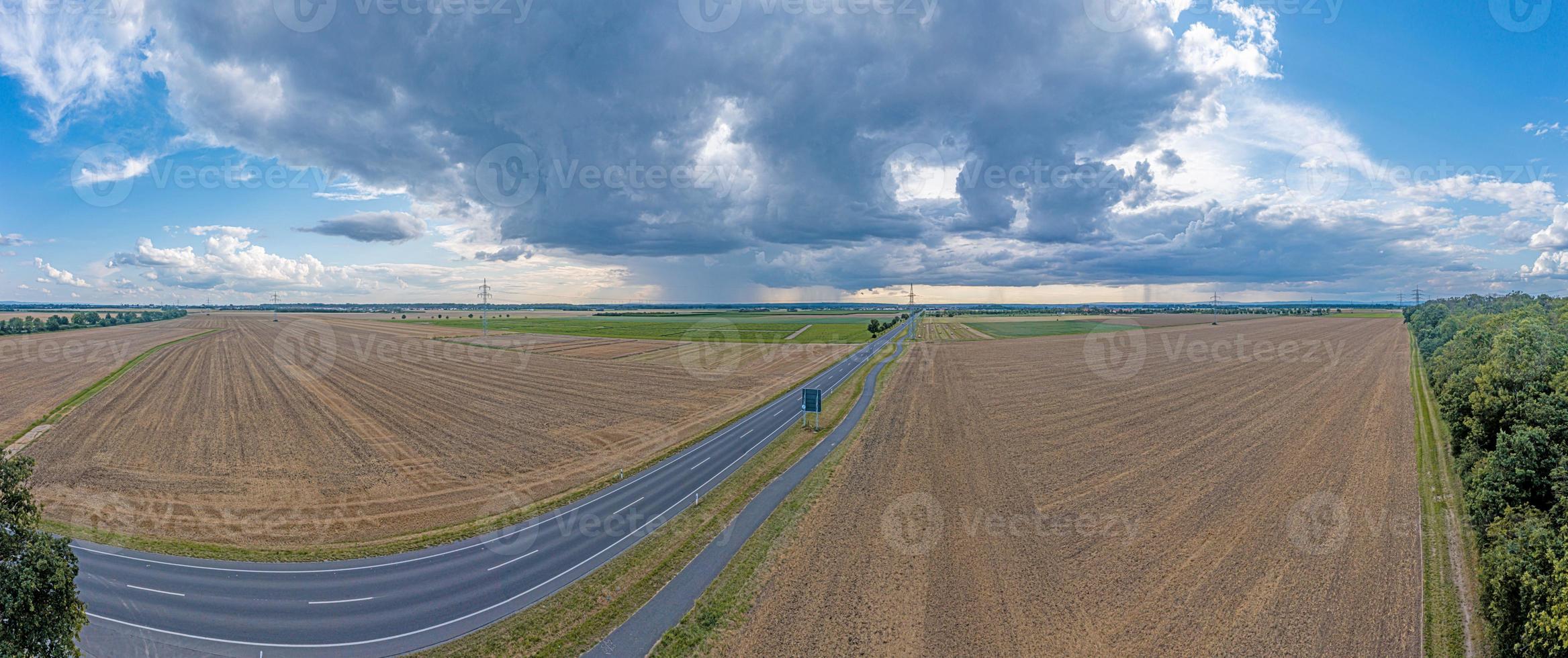 Drone panorama of a thunderstorm with rain and dramatic cloud formations over Leeheim in the Hessian Ried region photo