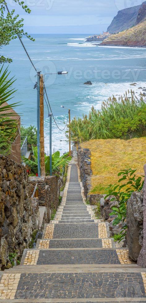 Downward view over staircase in the village Jardim do Mar towards the Atlantic ocean during daytime photo