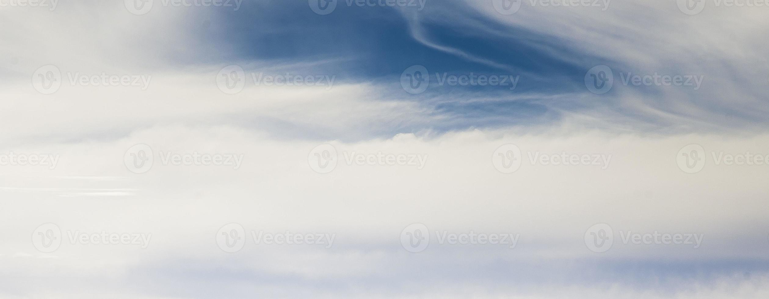 Image of a partly cloudy and partly clear sky during the day photo