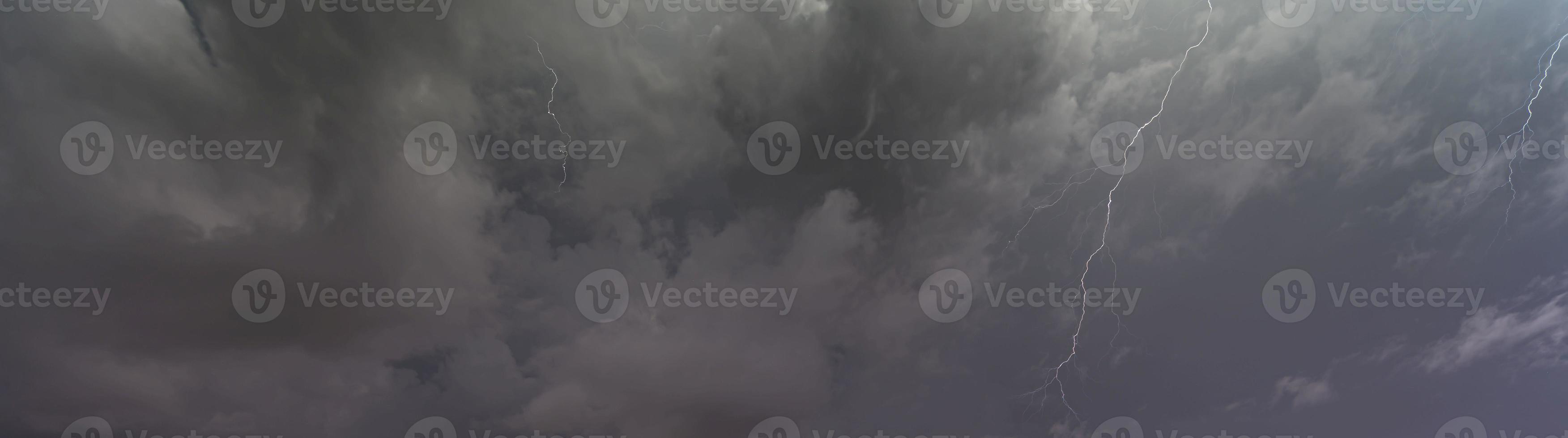 Picture of a flash in the night sky with glowing clouds photo