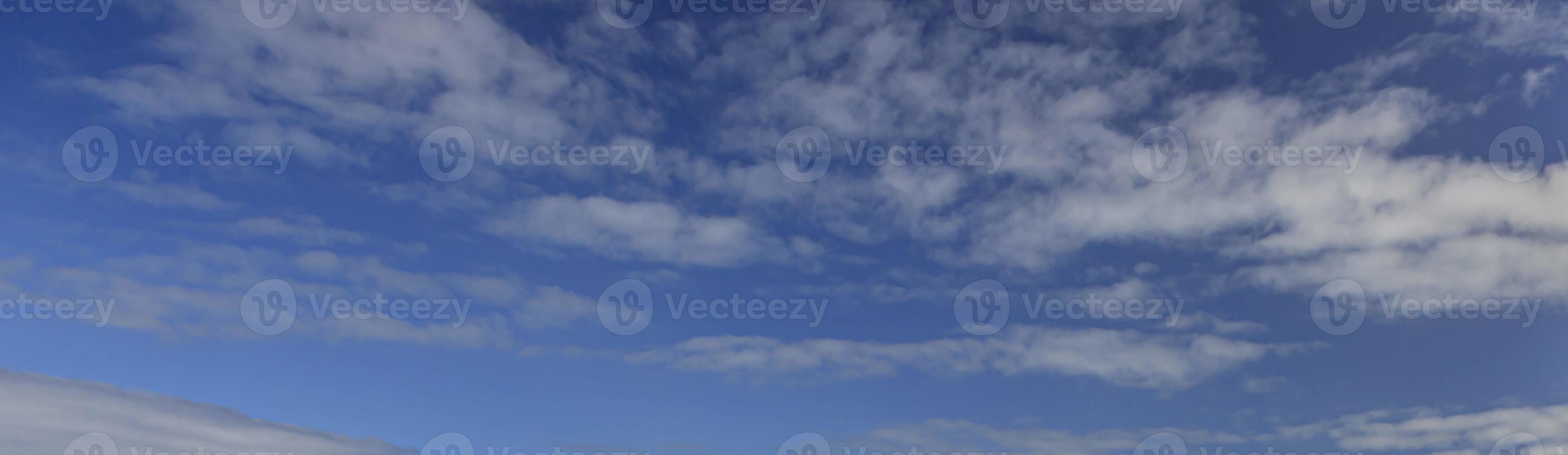 Image of a partly cloudy and partly clear sky during the day photo