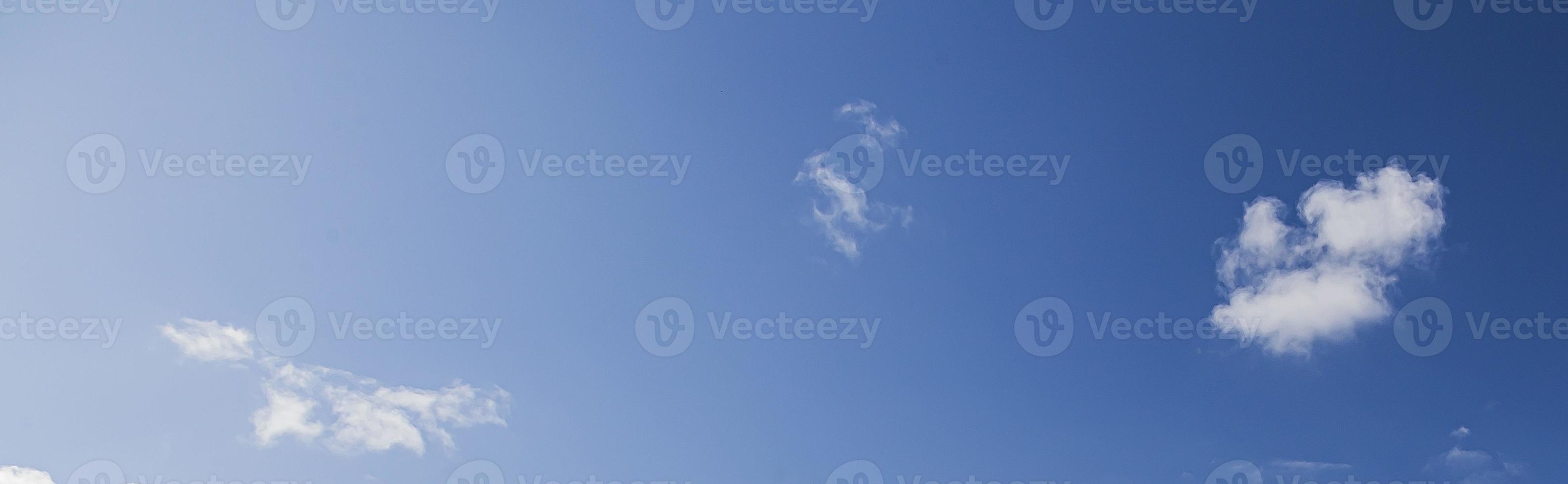 Image of a partly cloudy and partly clear sky during the day photo