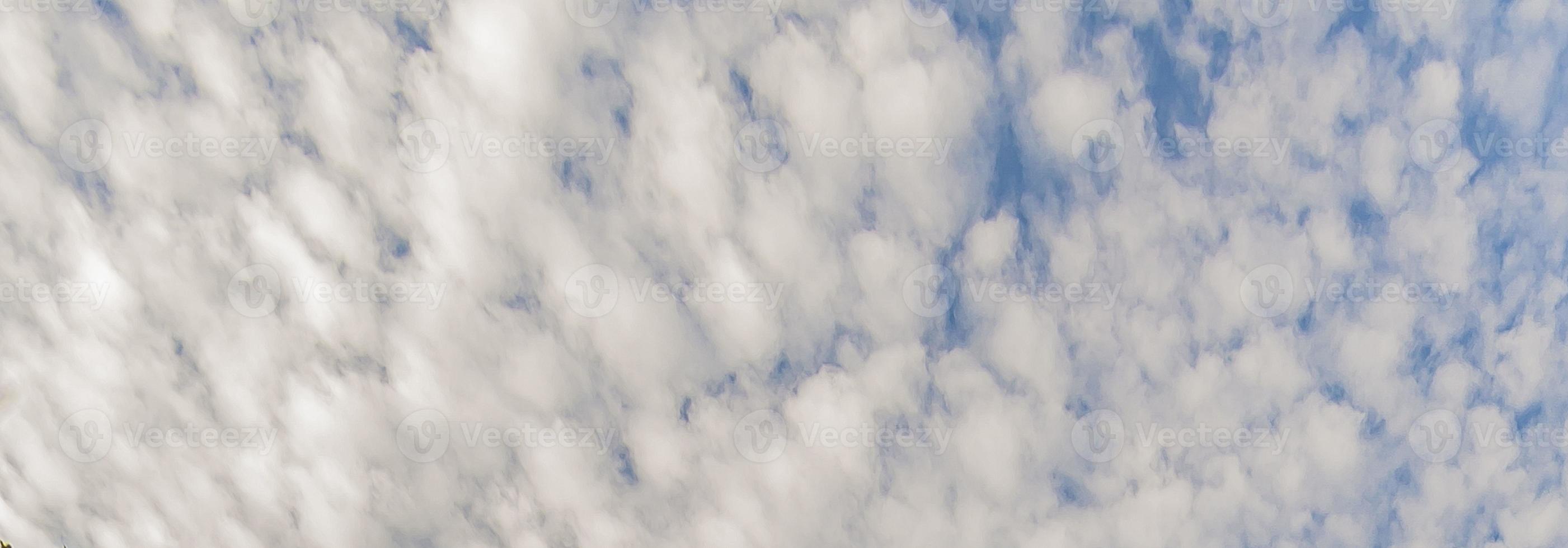 Image of a partly cloudy and partly clear sky during the day photo