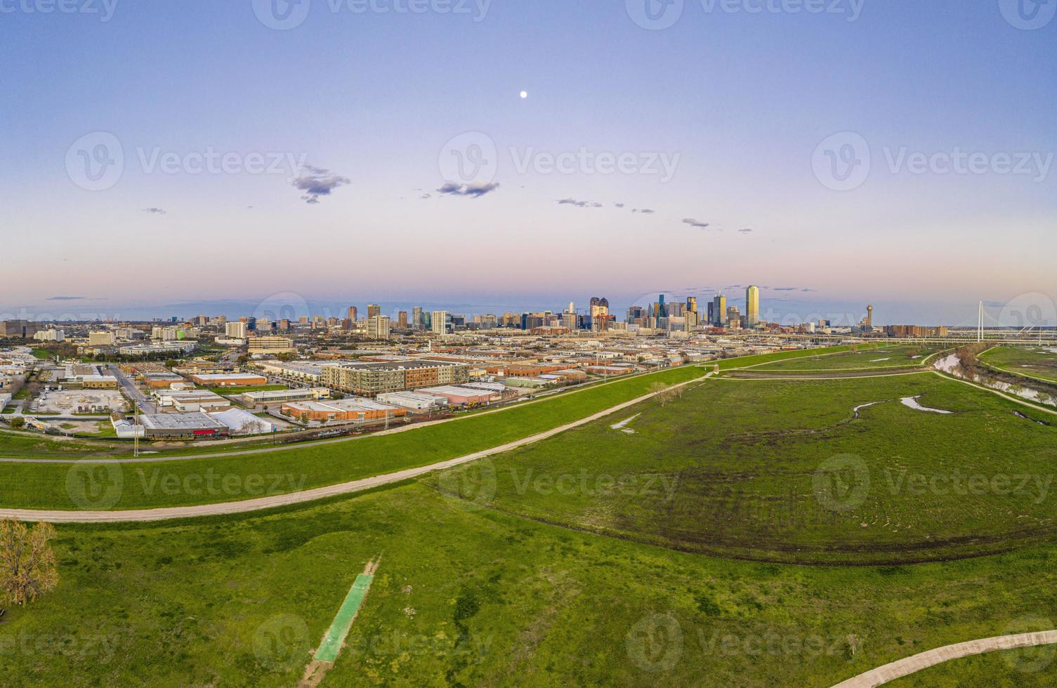 Panoramic aerial drone picture of Dallas skyline and Trammel Crow Park at sunset in winter photo