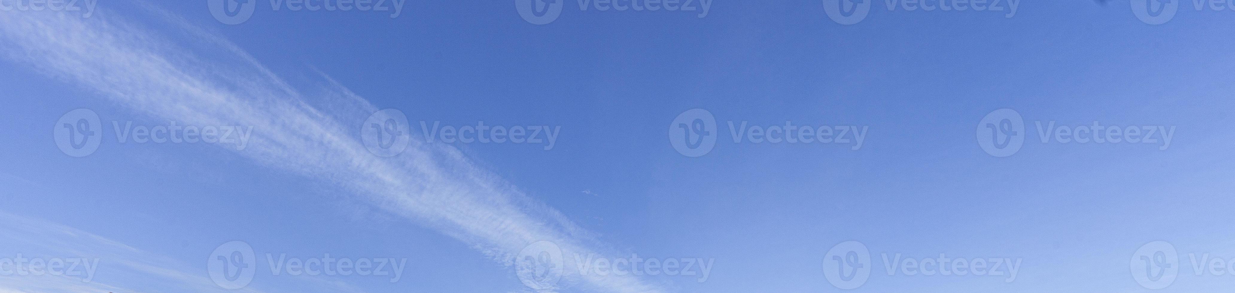 Image of a partly cloudy and partly clear sky during the day photo