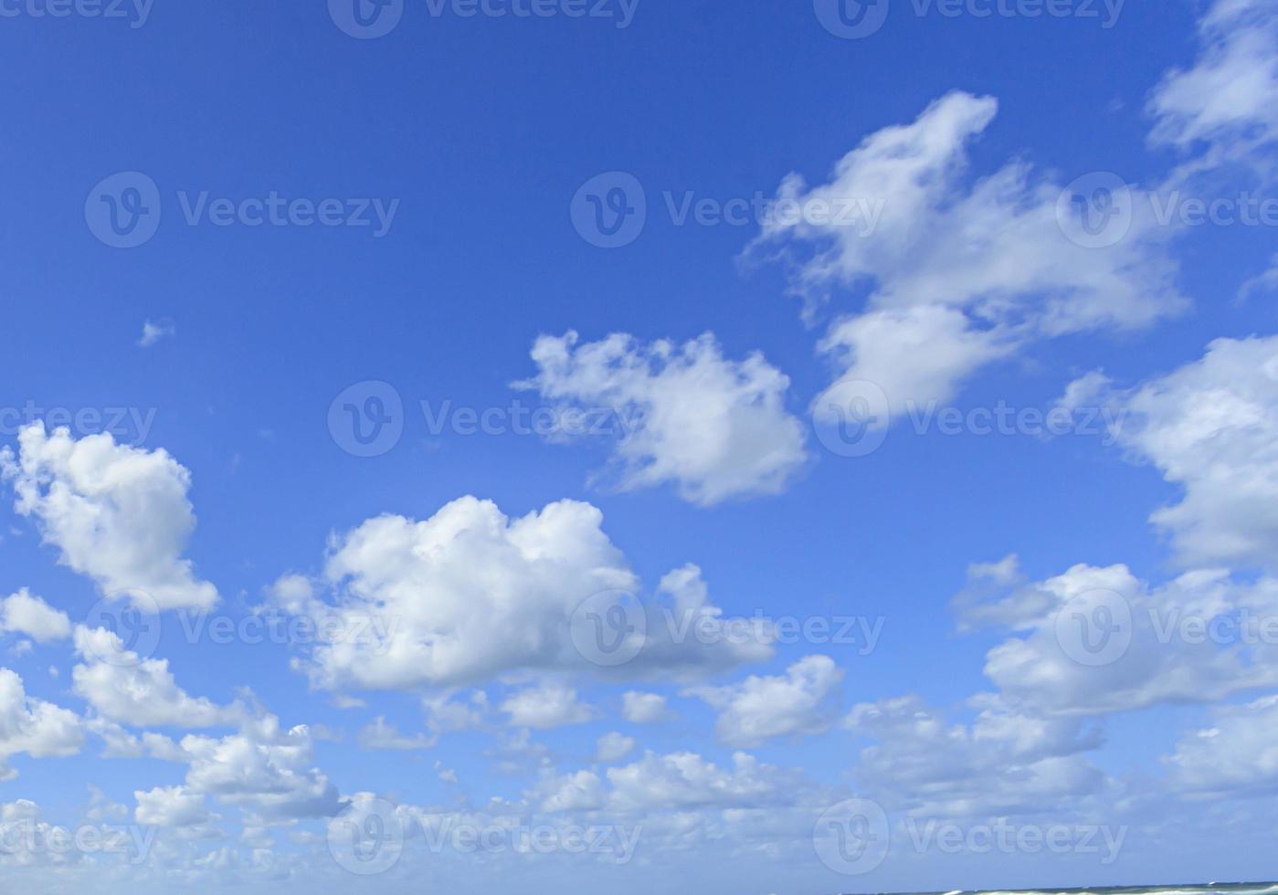 Image of a partly cloudy and partly clear sky during the day photo