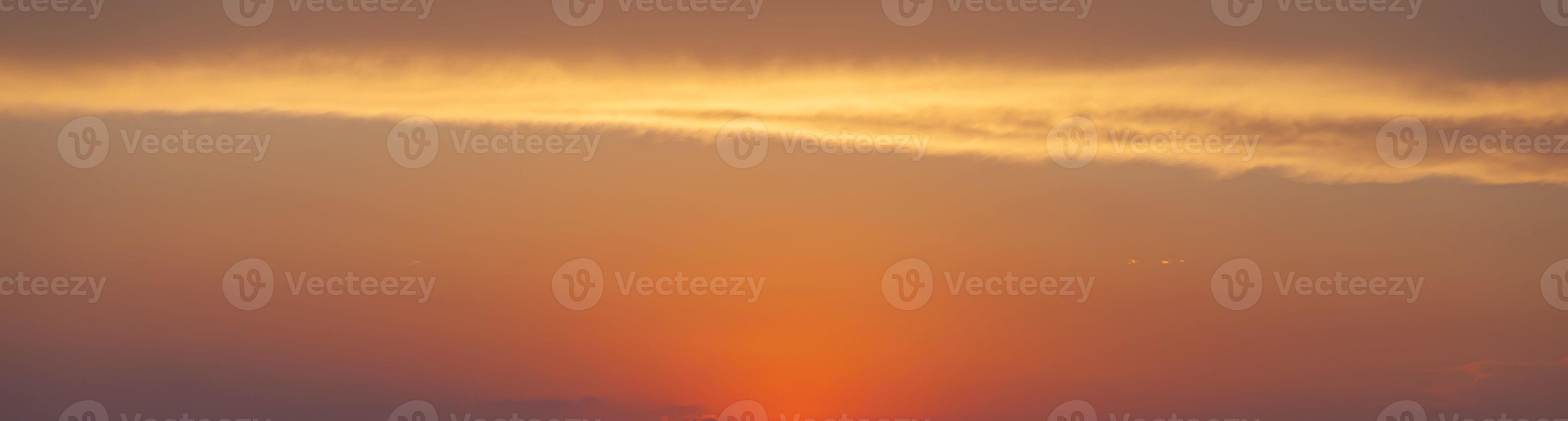 Dramatic colorful sky with afterglow and illuminated clouds photo