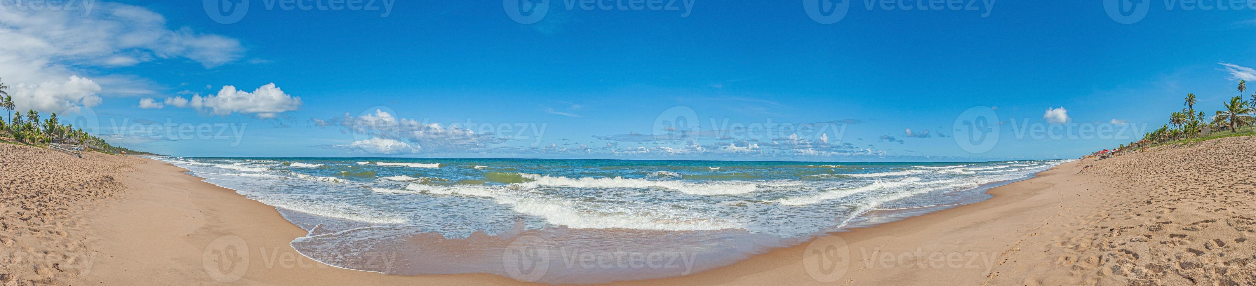Panoramic view over the endless and deserted beach of Praia do Forte in the Brazilian province of Bahia during the day photo