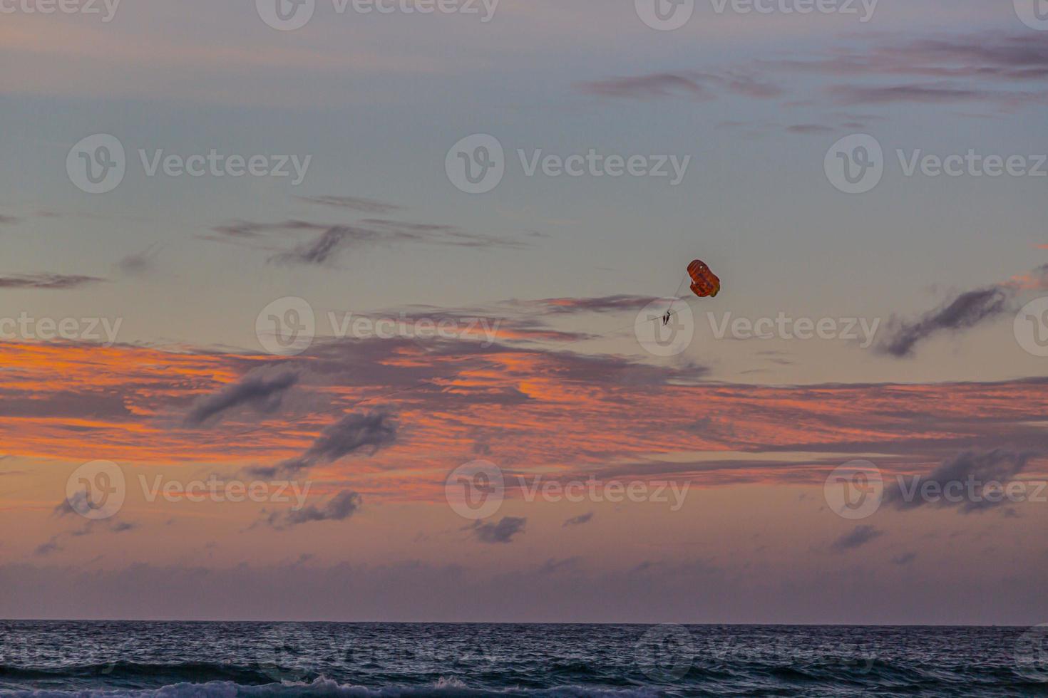 Picture of a paraglider at sunset from Kamala beach in Thailand in summer photo