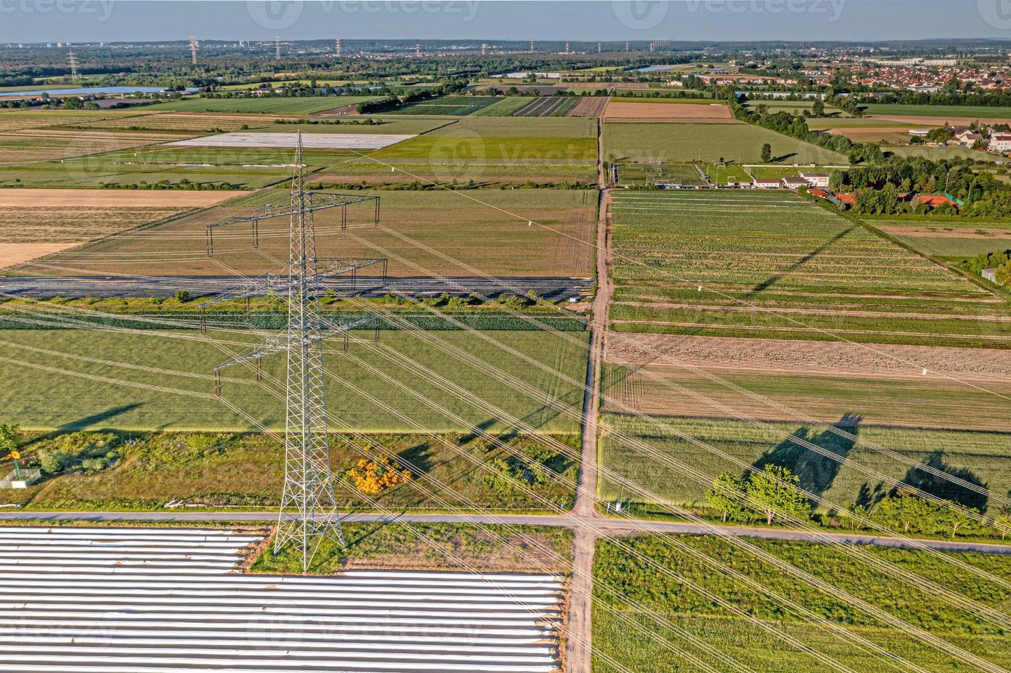 Panoramic image of high voltage road with high power poles in evening light photo