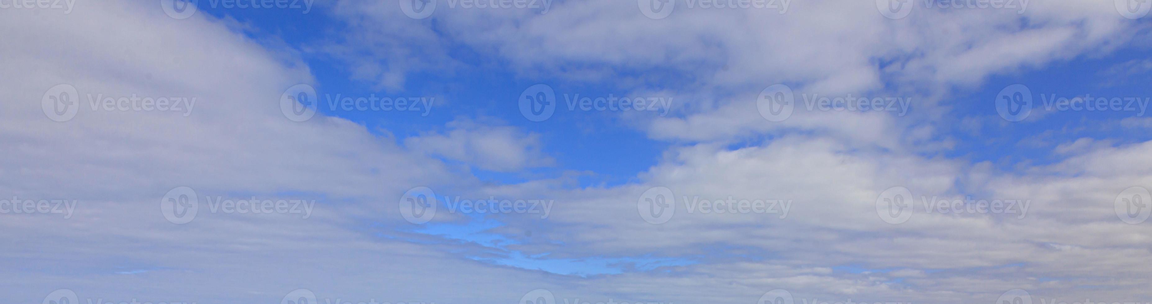 Image of a partly cloudy and partly clear sky during the day photo