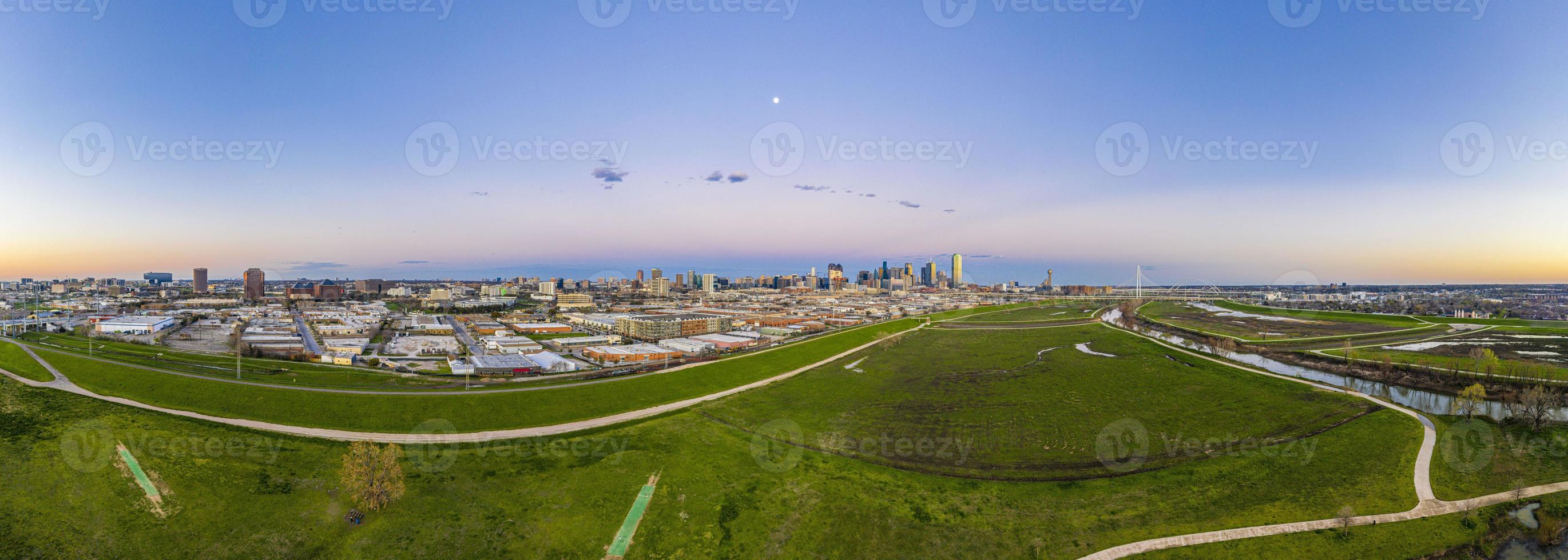 Panoramic aerial drone picture of Dallas skyline and Trammel Crow Park at sunset in winter photo