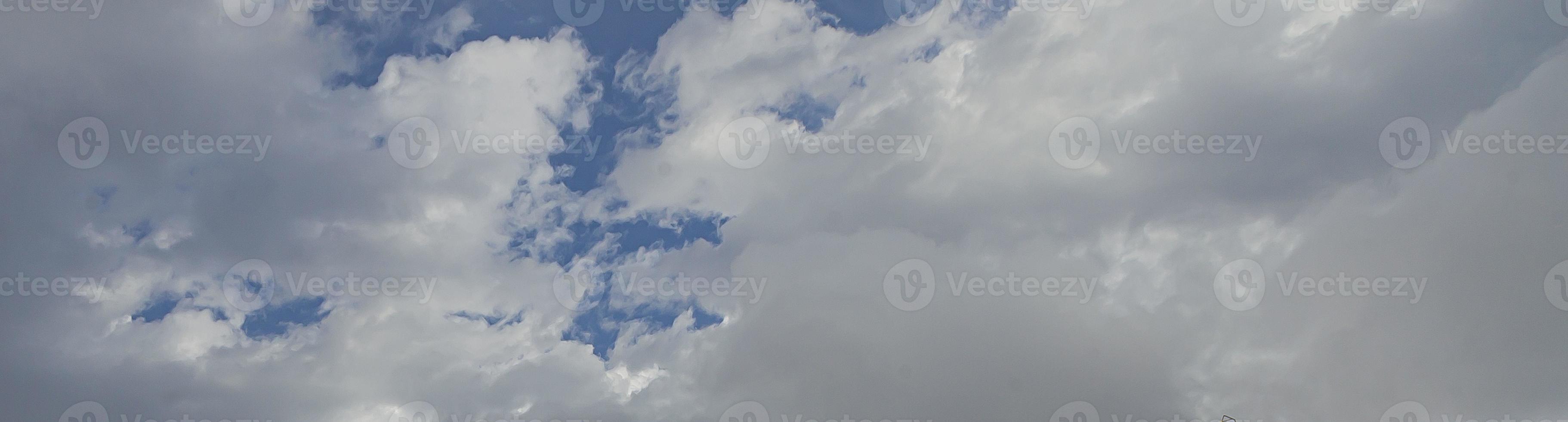 Image of a partly cloudy and partly clear sky during the day photo