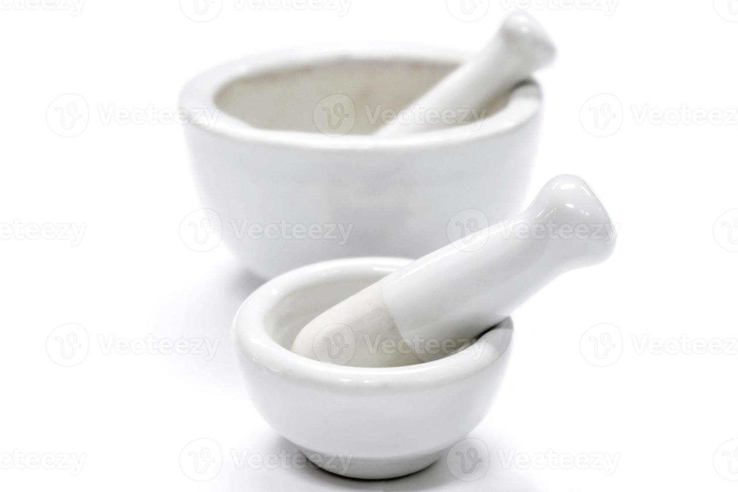 Herbs and medicine white mortars, Made by lime or ceramic on white background. photo