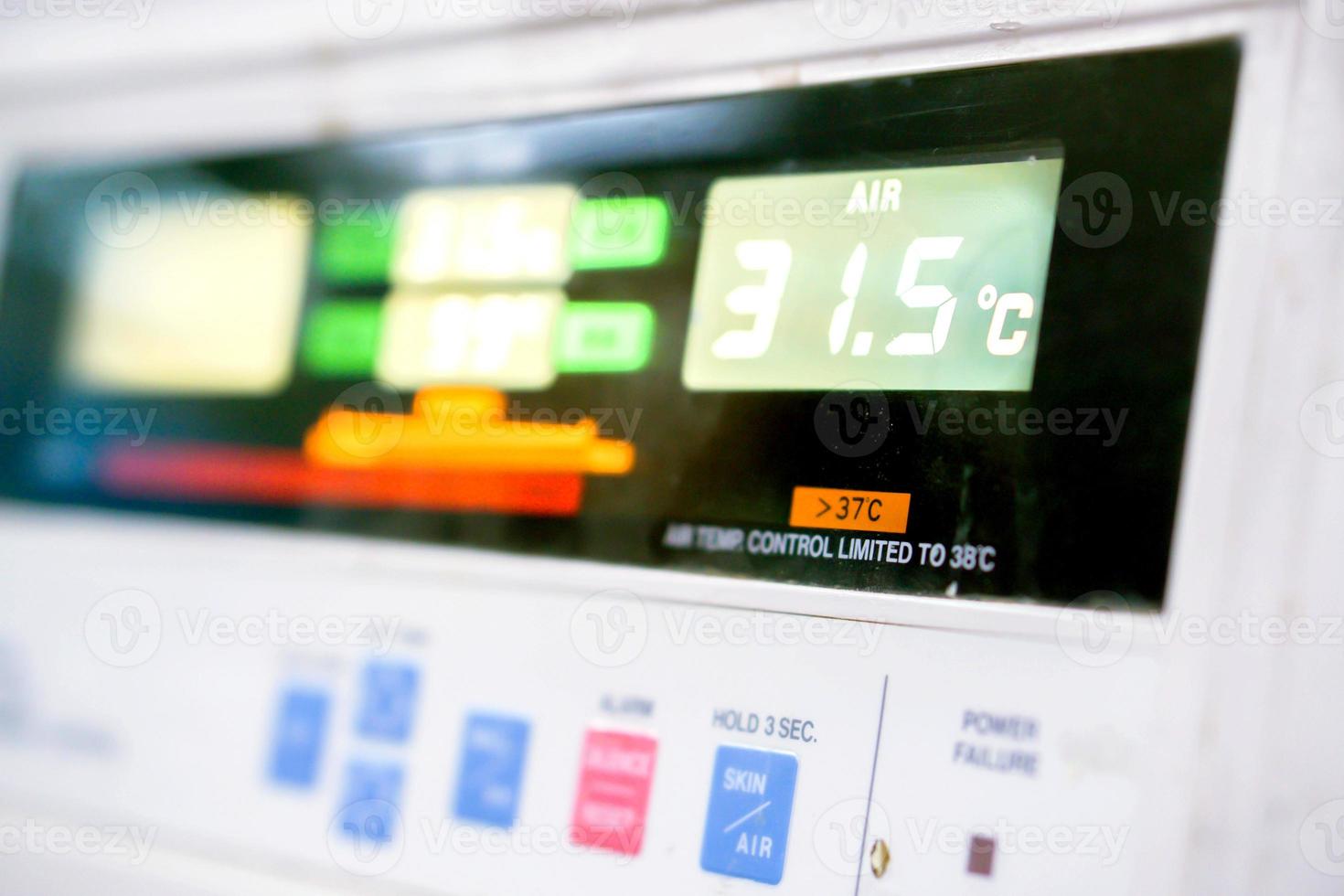 Close up of Temp monitor of baby incubator in the hospital with show the number of temperatures used to warm the sick newborn inside. photo
