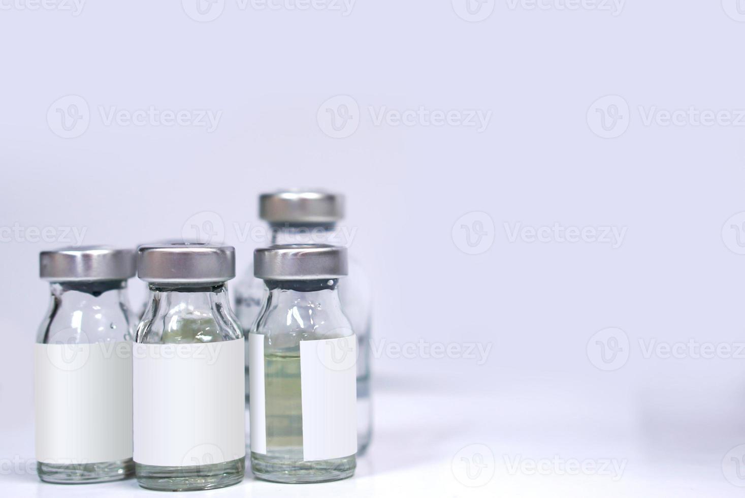 injectable drug bottles on white background. photo