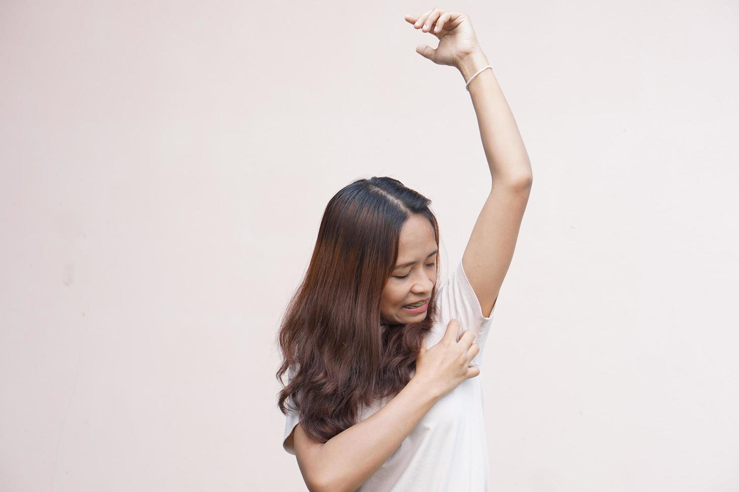 Asian women itching in their armpits photo