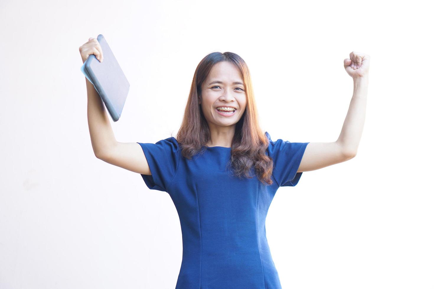 Businesswoman looking at a portable computer monitor Glad to have more profit photo