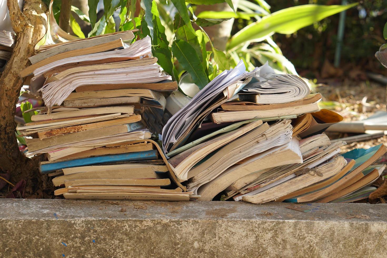 Stacks of old papers and books waiting to be recycled. photo