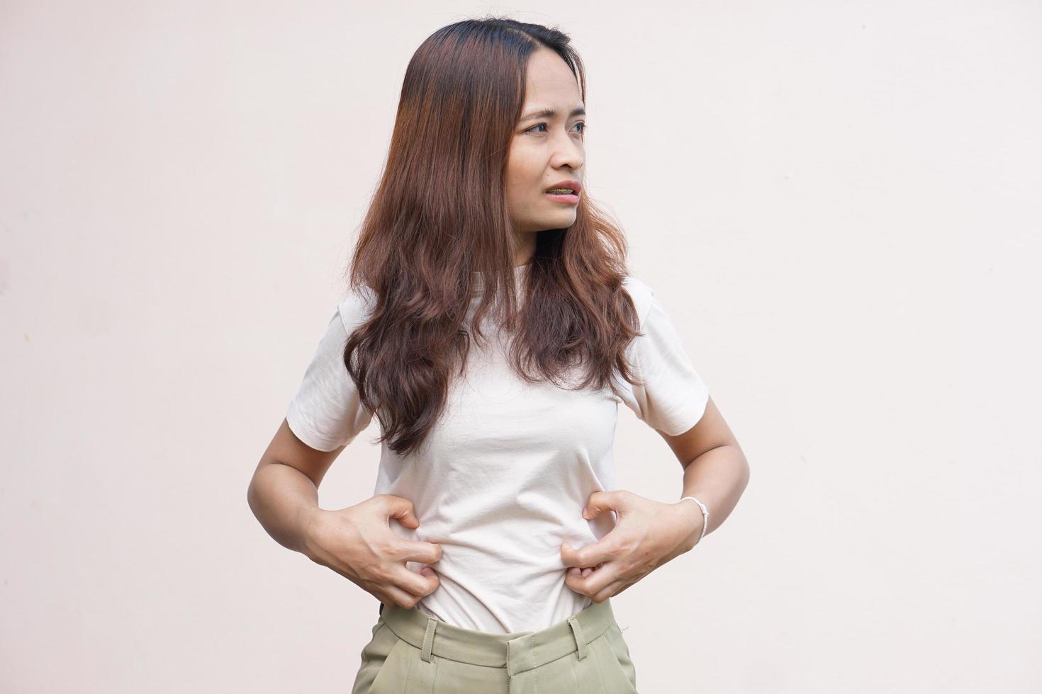 Woman suffer from stomachacheChronic gastritis Abdomen bloating concept photo