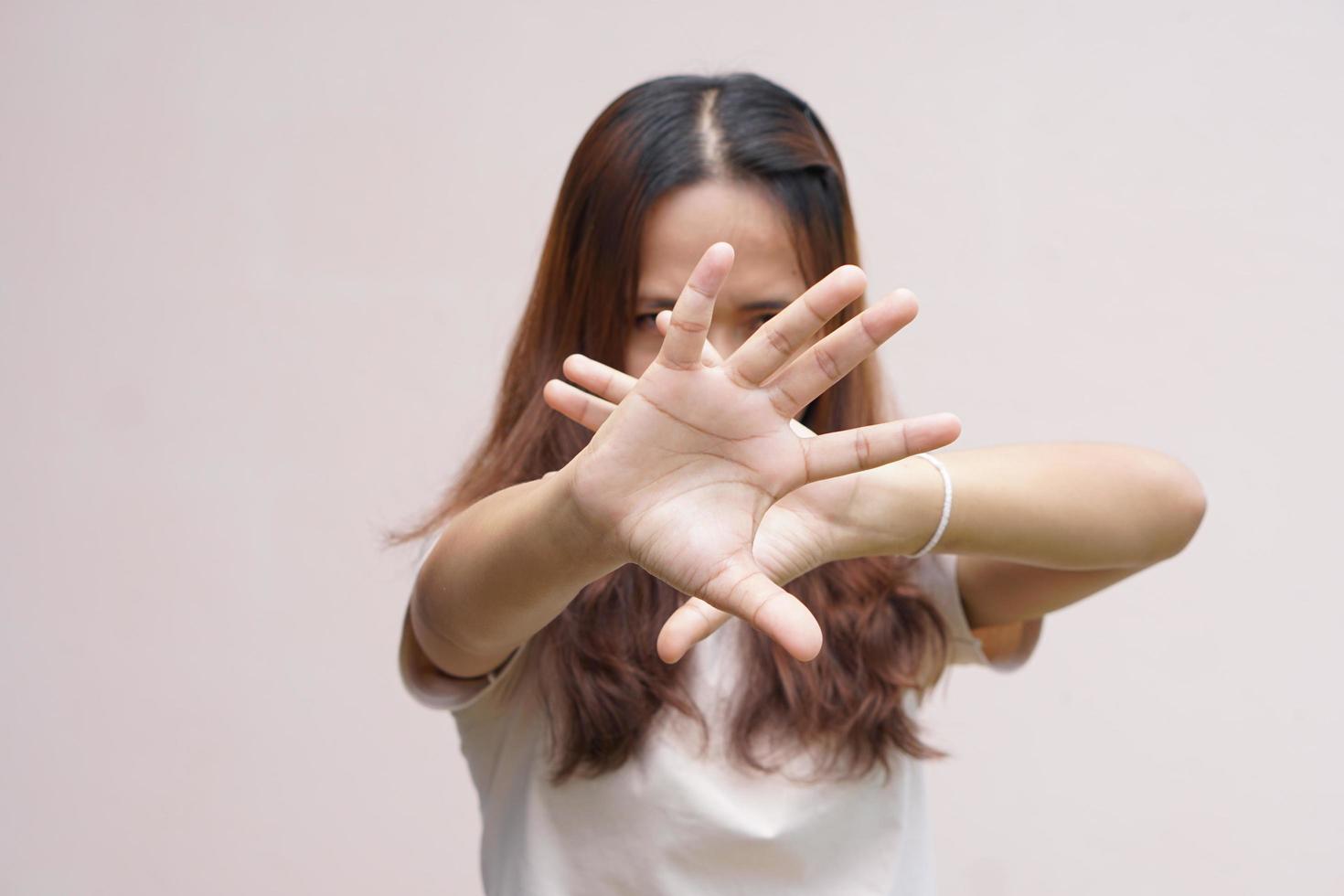 Woman raised her hand for dissuade, campaign stop violence against women photo